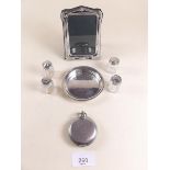 A modern silver photograph frame, four silver and glass cruets, silver pin dish and a silver