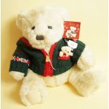 A large blond Harrods Christmas bear in cardigan