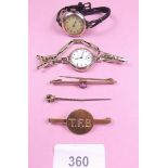 Two 9 carat gold ladies watches, a 9 carat gold TFB brooch and a 9 carat gold brooch set pink stone