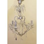 A cut glass three branch chandelier with silvered finish frame
