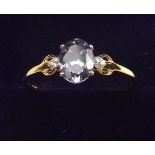 A 9K gold tanzanite ring on diamond set shoulders, size T