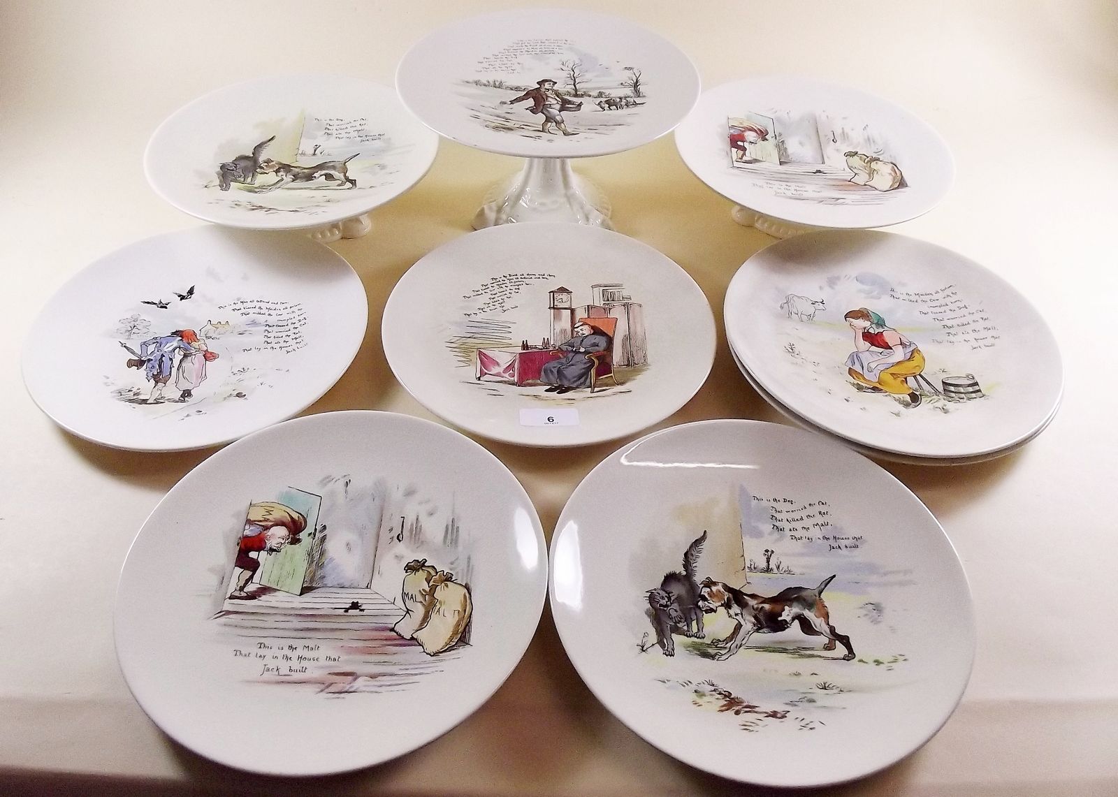 A Bishop and Stomer Nursery Ware dessert service comprising six plates and three comports printed "