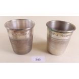A pair of silver plated novelty thimble form tumblers engraved 'Just A Thimbleful', 8.5cm high