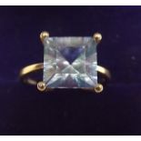 A 9K gold ring set aurora topaz, size M and a half