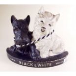 A 'Black and White' whisky Scottie Dog bar advert