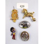 A group of brooches, a Robertsons Golly badge and an Essex Crystal