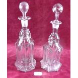 A pair of Victorian ribbed glass decanters