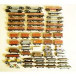 A box of Hornby Dublo three rail freight wagons including: brick bolster wagons, box vans, brake