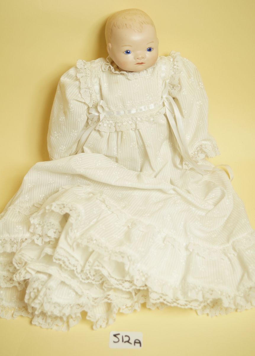 A reproduction bisque headed doll with impressed mark Grace R Putnam