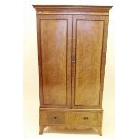 A mahogany two door wardrobe with drawer under by Bartholomew and Fletcher, 95 wide x 56 deep x