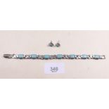 A silver and turquoise set bracelet and earrings