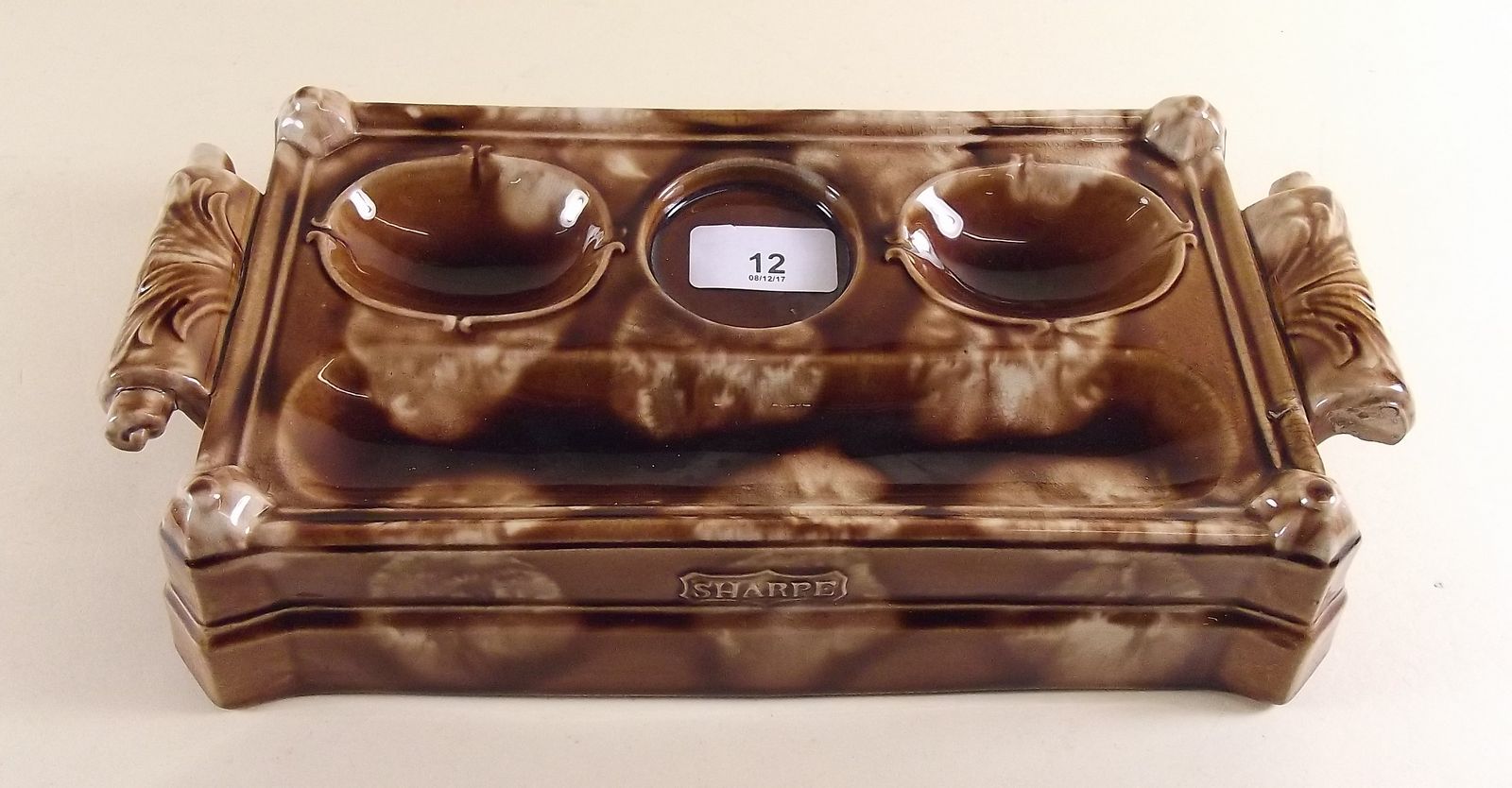 A Victorian Staffordshire brown mottled glazed inkstand with foliate handles