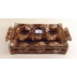 A Victorian Staffordshire brown mottled glazed inkstand with foliate handles