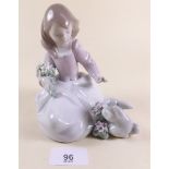 A Lladro figure of a seated girl with rabbit - boxed 'Forest Encounter'
