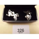 A pair of silver gardening themed cufflinks in form of watering can and tools - boxed