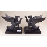 A pair of cast bronze griffins - 18cm tall