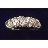 A 10k white gold ring set double row of diamonds with diamond set spiral wrap, size Q