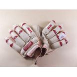 A pair of cricket batting gloves