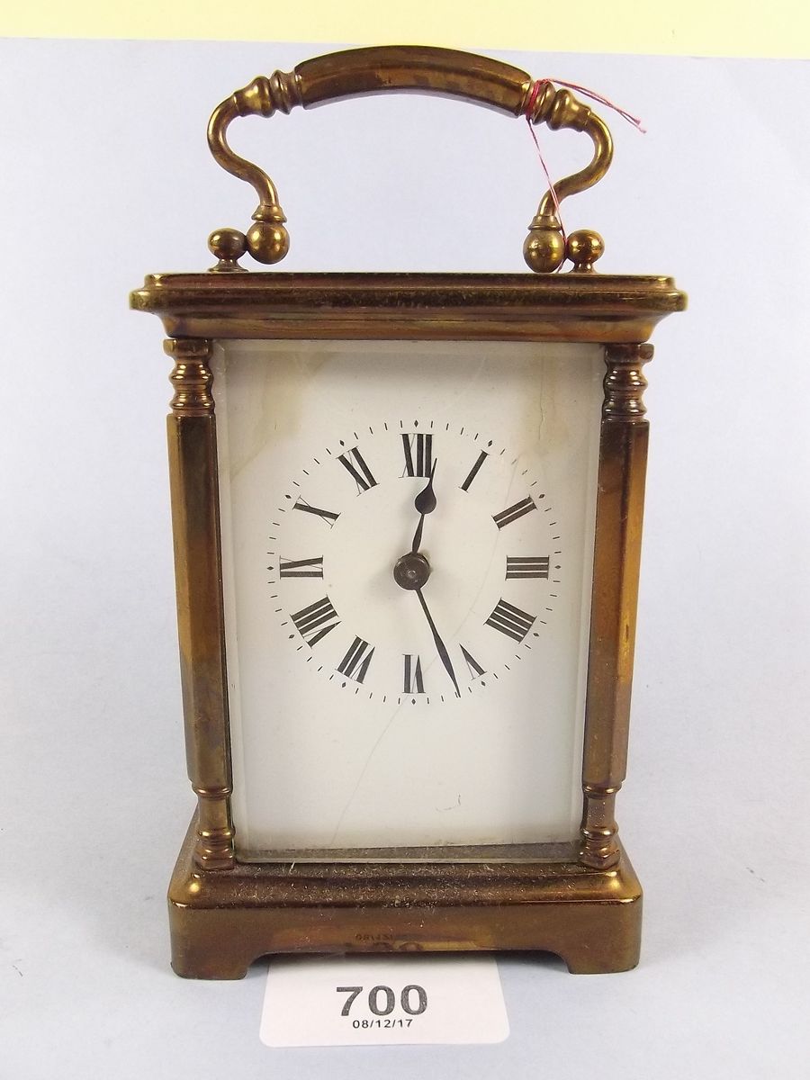 A brass cased carriage clock and key