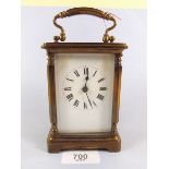 A brass cased carriage clock and key