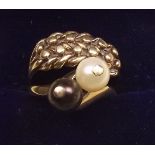 A 9 carat gold and pearl ring and a 9 carat gold plaited ring