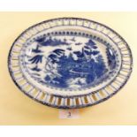 An early 19th century creamware blue and white oval woven basket dish decorated in the chinoiserie