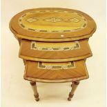 A nest of three oval Eastern inlaid occasional tables