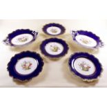 A Victorian porcelain dessert service painted flowers within deep blue and gilt ground - No 5794