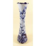 An early William Moorcroft Florian Ware blue floral vase - 30cm, chipped to rim