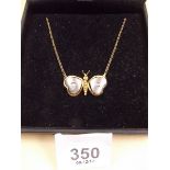 An 18 carat gold butterfly pendant set diamonds
