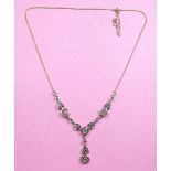 A 14ct gold pendant necklace set emeralds and diamonds