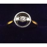 An 18 carat gold ring set three diamonds within circlet - size M