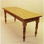 A pine farmhouse dining table with drawer to side all on turned supports 183 x 72cm wide