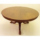 A Victorian circular mahogany breakfast table on carved column and triple curved supports, 138cm