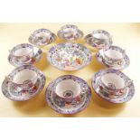 A set of eight 19th century Chinoiserie decorated tea cups and saucers and a large saucer dish