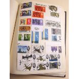 A blue album of GB, Commonwealth, All World Mint and used stamps