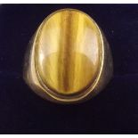 A 9 carat gold gents ring set tigers eye - 5.4g, size S