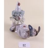A Lladro figure of a reclining clown - boxed 'Tired Friend'