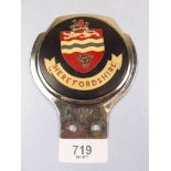A vintage chrome Herefordshire car badge