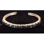 A silver bangle set London blue topaz