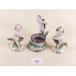 A Berlin cherub group and two Capodimonte cherubs - all a/f