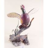 A Franklin Mint porcelain pheasant by A J Rudisill - 31cm