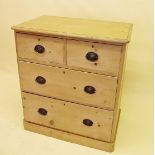 A small Victorian pine chest of two short and two long drawers, 80cm wide x 47 cm deep x 91cm high