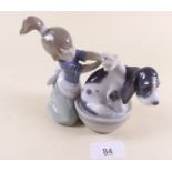 A Lladro figure of a girl and dog - boxed 'Bashful bather'