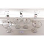 Four Babycham glasses and three cherry liqueur glasses