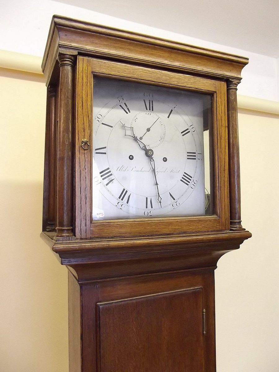 An 18th century oak longcase clock with earlier 17th century 8 day striking movement by Abel