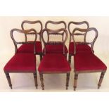 A set of six Victorian rosewood balloon back dining chairs with carved bar splat all raised on