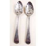 A pair of Georgian silver dessert spoons later embossed as berry spoons