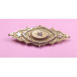 A Victorian 9 carat gold lozenge form brooch set chip diamond