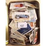 A tin of cigarette cards